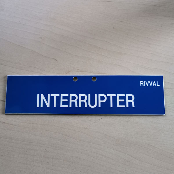 Sign - [Interrupter] 200 X 49Mm Traffolyte Plate With Predrilled Hole X2 Background = White Lettering = Blue